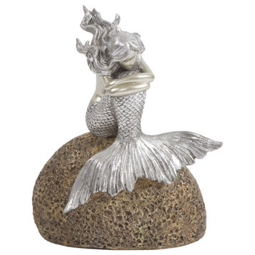 Contemplative Mermaid on a Rock Sculpture