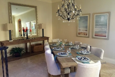 Inspiration for a large transitional separate dining room in Tampa with beige walls, carpet and no fireplace.