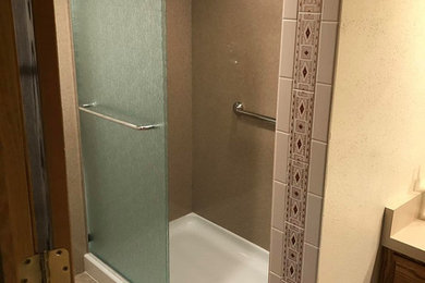 Mid-sized elegant 3/4 beige tile bathroom photo in Other with beige walls and laminate countertops
