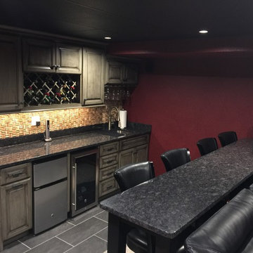 Custom Grey Distressed Cabinetry w/ Steel Grey Granite Tops (Cork Backsplash)