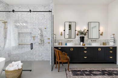 Large classic ensuite bathroom in Boise with shaker cabinets, black cabinets, a built-in shower, porcelain flooring, a vessel sink, engineered stone worktops, a sliding door, white worktops, a wall niche, double sinks and a built in vanity unit.