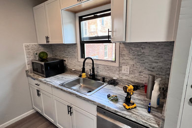 Kitchen - transitional kitchen idea in Other