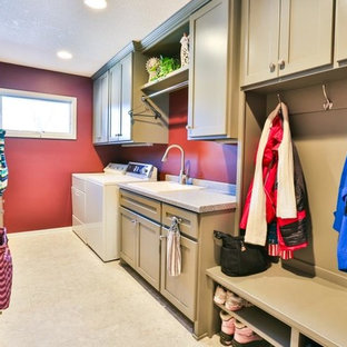 Design ideas for a medium sized classic galley utility room in Minneapolis with a built-in sink, shaker cabinets, beige cabinets, granite worktops, red walls, ceramic flooring and a side by side washer and dryer.
