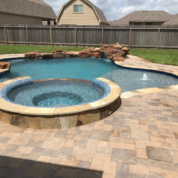 Cozy Lagoon pool with jump rocks and waterfall