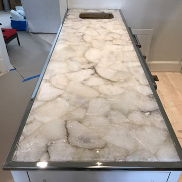 Custom stainless mirror polish trim on an LED lit onyx Crystal top... very cool