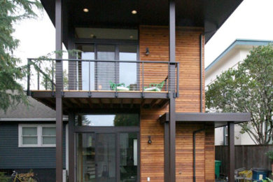 Inspiration for a mid-sized contemporary brown two-story mixed siding exterior home remodel in Portland