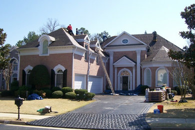 Example of a classic two-story exterior home design in Atlanta with a shingle roof