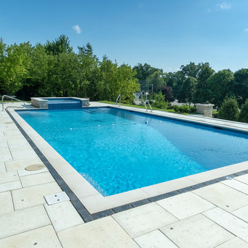 Burr Ridge Lap Pool with Raised Hot Tub and Waterfall