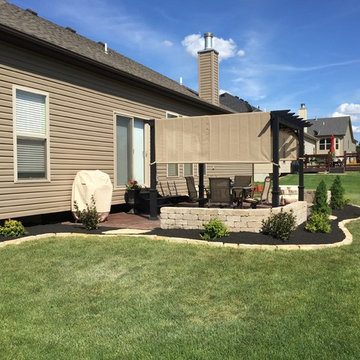 Patio pergola/custom sitting seat-walls/aptio staining/professional landscaping