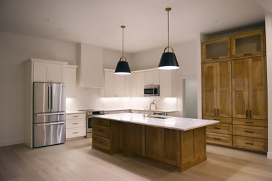 Example of a large country l-shaped eat-in kitchen design in Other with shaker cabinets, quartz countertops, white backsplash, porcelain backsplash, an island and white countertops