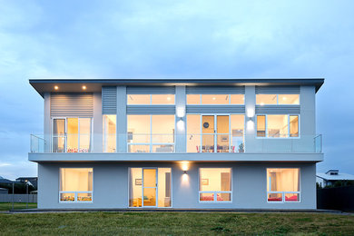 This is an example of an expansive beach style two-storey exterior in Adelaide.