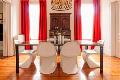 Enclosed dining room - mid-sized eclectic medium tone wood floor enclosed dining room idea in Other with gray walls and no fireplace