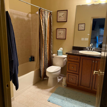 Bathroom Renovation – Navy Vanity + Marble Tile + Brass Accents