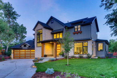 Inspiration for a large farmhouse green two-story wood exterior home remodel in Denver with a shingle roof
