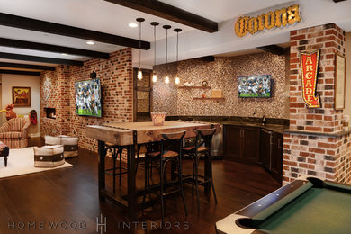 Large transitional walk-out dark wood floor basement photo in Baltimore with gray walls and a brick fireplace