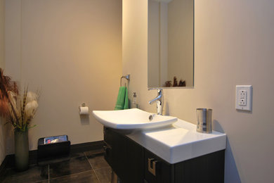 Minimalist bathroom photo in Montreal with a console sink
