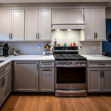 Two-Tone Neutral Kitchen with Quartz Countertop and Soho Picket Backsplash