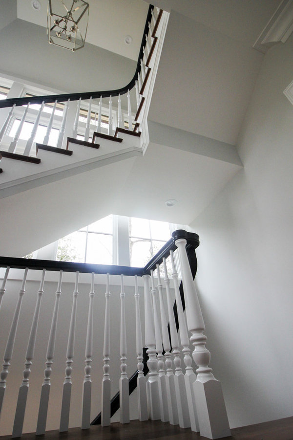 Powerful Impression by Floating Staircase in Suburban Foyer