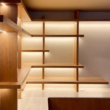 Bibliothèque sur mesure rétroéclairée et espace de travail – Projet Onzième