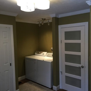 Medium sized contemporary utility room in Cleveland with green walls and medium hardwood flooring.
