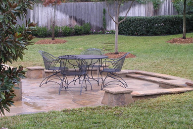 Photo of a small traditional side yard patio in Dallas with a fire feature, concrete pavers and an awning.
