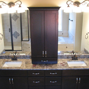 Chocolate Bordeaux granite on cherry espresso cabinets