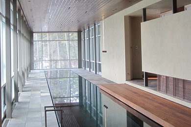 Pool - large contemporary indoor tile and rectangular lap pool idea in Los Angeles