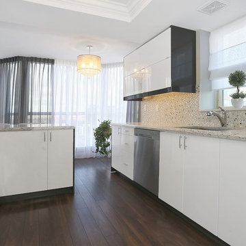 Condo kitchen counter top. Quartz, warm colors.