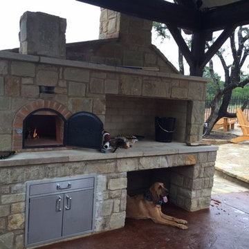 Outdoor wood fired pizza oven + stone outdoor fireplace