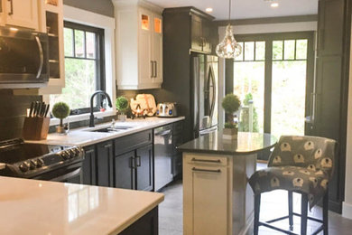 Example of a mid-sized cottage u-shaped slate floor and gray floor eat-in kitchen design in Other with an undermount sink, recessed-panel cabinets, white cabinets, quartzite countertops, gray backsplash, ceramic backsplash, stainless steel appliances, an island and white countertops