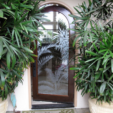Etched glass tropical foliage on entryway door