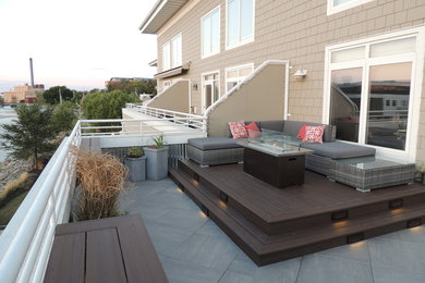 Small modern balcony in Other with a fire feature and metal railing.