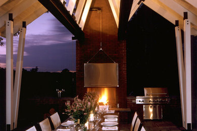 This is an example of a mid-sized contemporary porch design in New York.