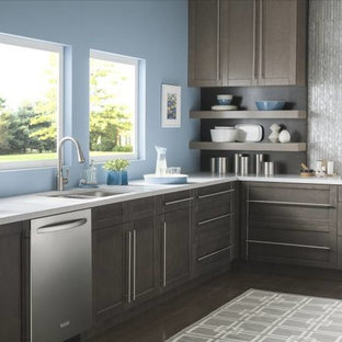 Mid-sized modern kitchen pantry inspiration - Example of a mid-sized minimalist l-shaped medium tone wood floor kitchen pantry design in Cleveland with an undermount sink, recessed-panel cabinets, medium tone wood cabinets, marble countertops, gray backsplash, ceramic backsplash and stainless steel appliances