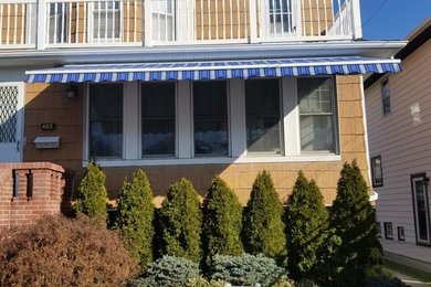 This is an example of a coastal porch design in New York.