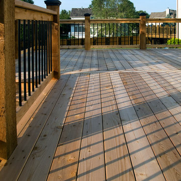 Smith - Cedar deck in Kansas City with stamped concrete patio.