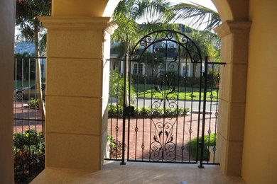 Example of a tuscan home design design in Tampa
