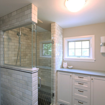 Marble Tiled Shower with Glass Panel and Glass Door