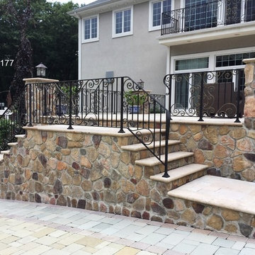 Raised Porch with Stacked Stone Facade by Gappsi