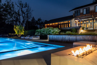 Example of a cottage chic pool design in Detroit