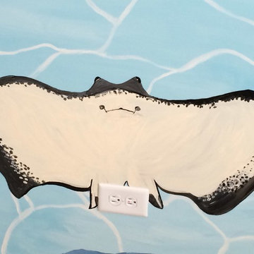 A ray swimming up at you in the Stingray Mural.