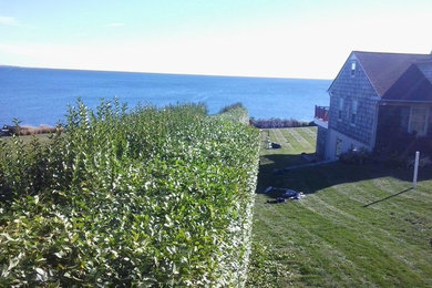 Photo of a large coastal full sun side yard garden path in Providence for spring.