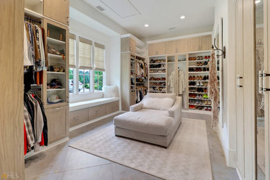 Walk-in closet - large gender-neutral gray floor walk-in closet idea in Atlanta with shaker cabinets and light wood cabinets