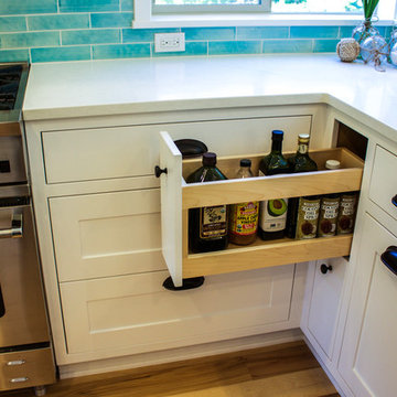 White Kitchen with Bold Blue Backsplash