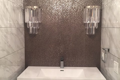 Example of a trendy powder room design in New York