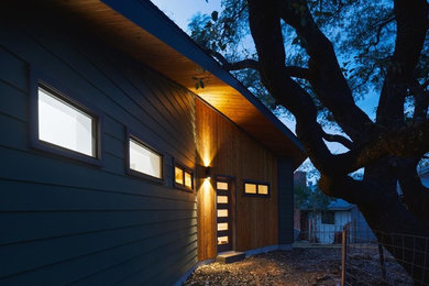 Example of a small minimalist multicolored one-story wood house exterior design in Austin