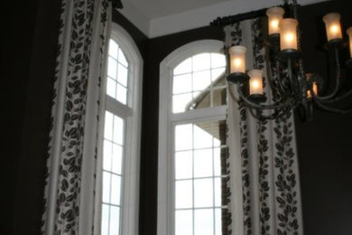 Large transitional light wood floor dining room photo in Other with brown walls