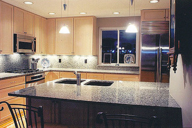 Kitchen - large light wood floor kitchen idea in DC Metro with a double-bowl sink, light wood cabinets, granite countertops, gray backsplash and an island