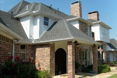 Two-story mixed siding exterior home photo in Dallas