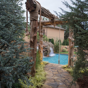 Multi-Level Pool with Rope Swing, Sunken Fire Pit, Waterfalls & Swim Up Bar